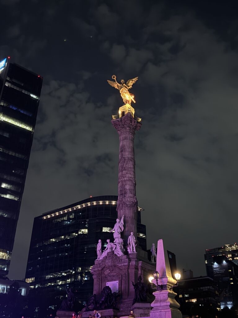 The Angel of Independence shines at night in the plaza of Mexico City